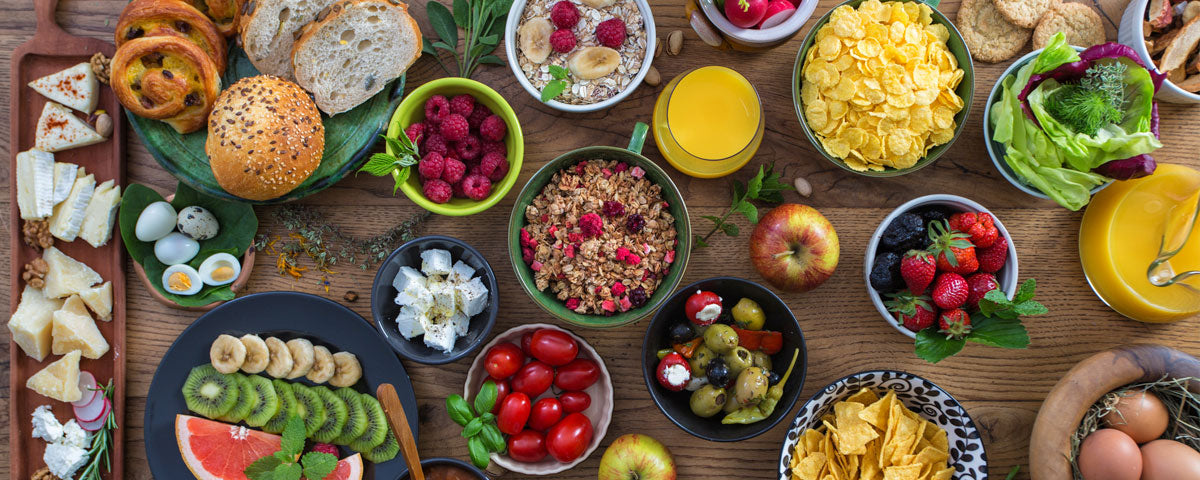 A table full of foods that are high in carbohydrates