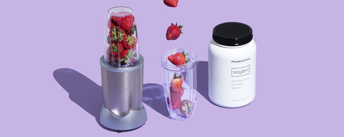 Blender filled with strawberries and Soylent powder