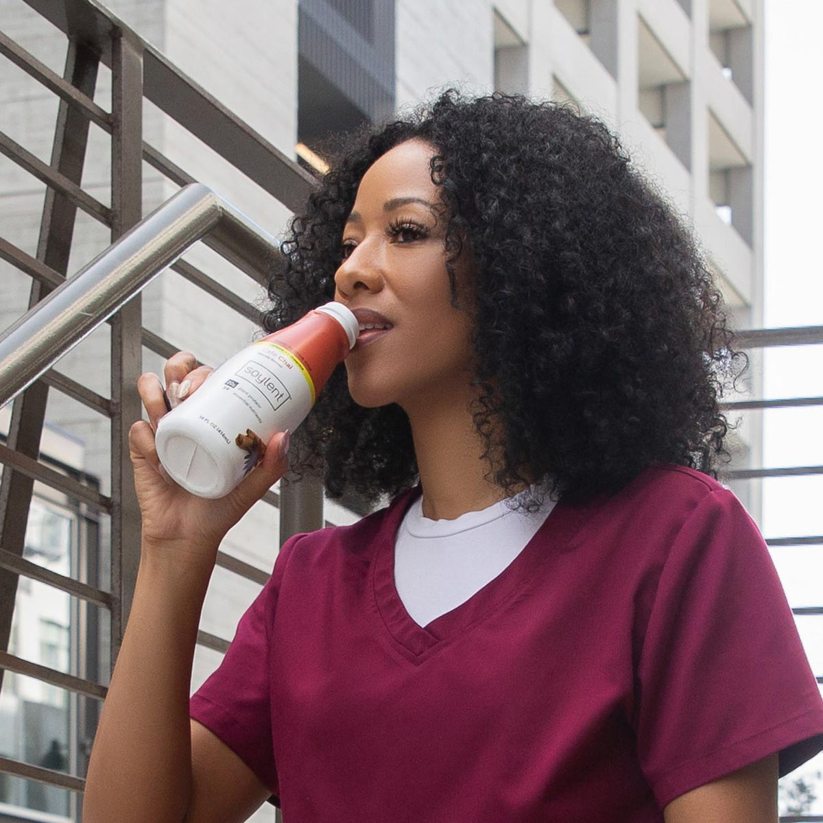 Woman drinking Soylent